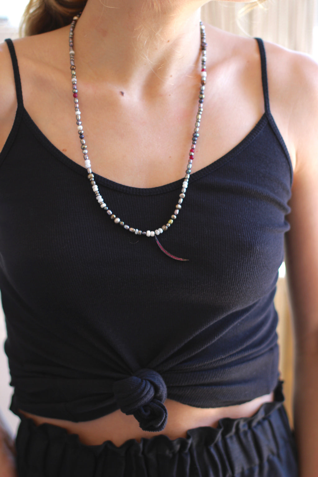 multi colored pearls with red chrystal slivered moon.
