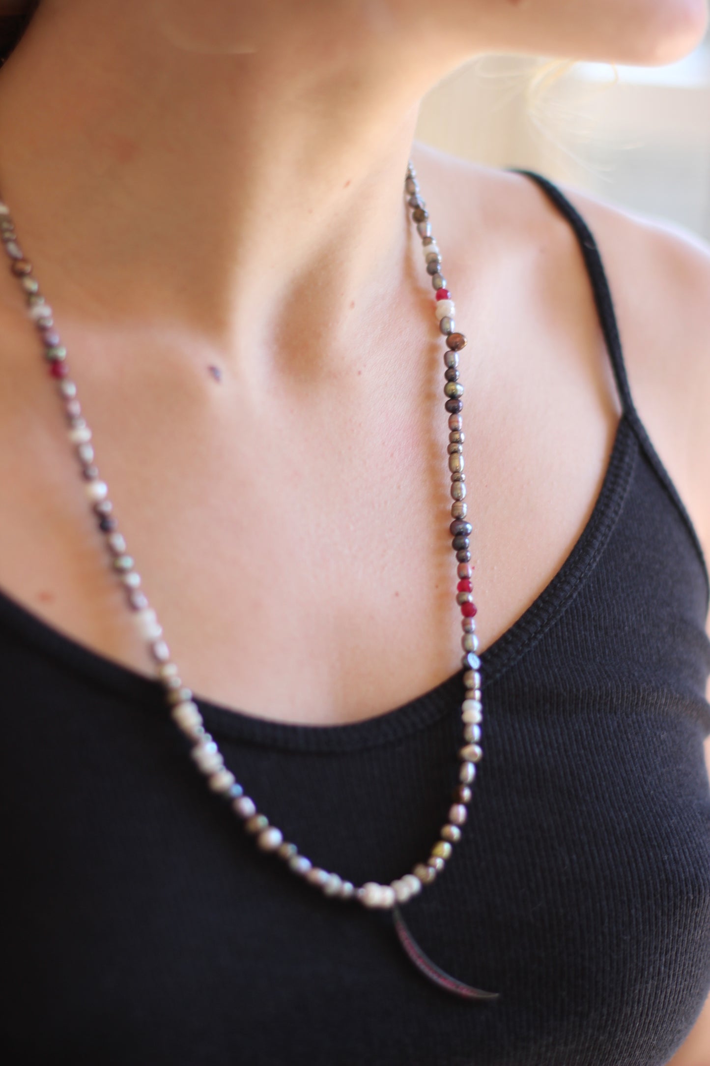 multi colored pearls with red chrystal slivered moon.