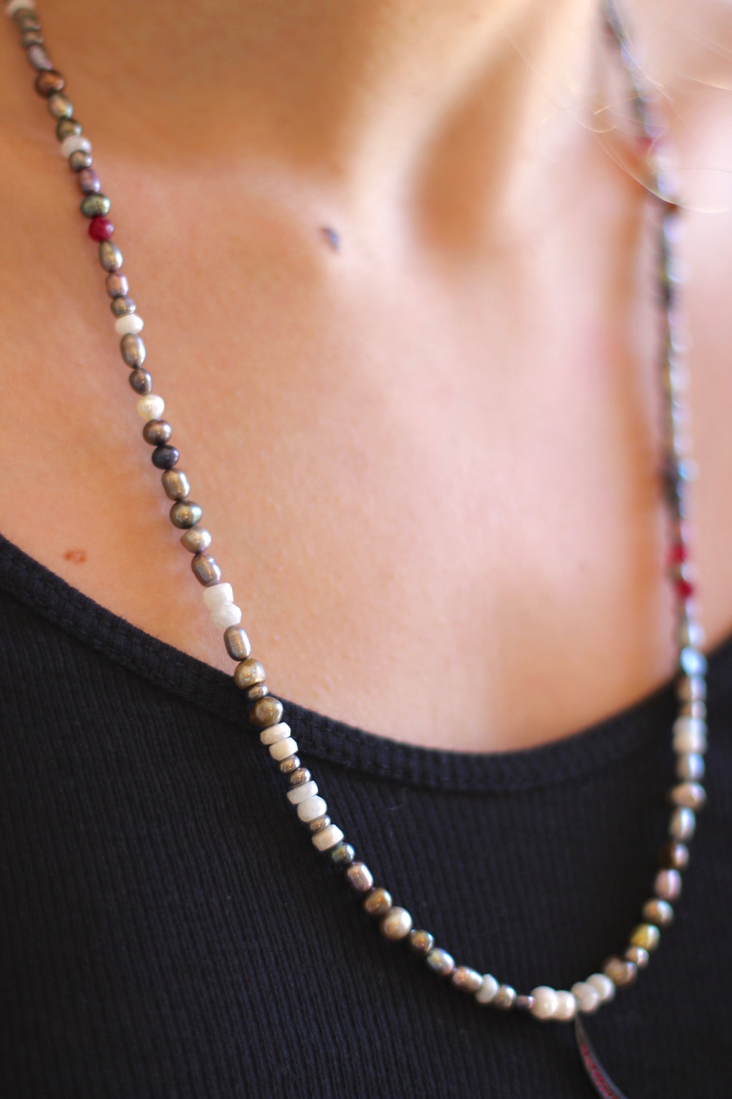multi colored pearls with red chrystal slivered moon.